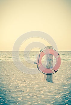 Life preserver on sandy beach