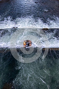 A life raft floating in the waterfalls
