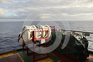 life rafts stowed on the cradles photo