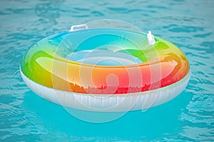 Life resque rubber circle in swimming pool. Help concept. Summer vacation. Rubber circle, aquapark, swimming pool photo