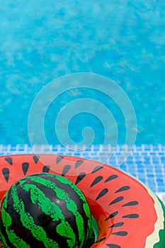 Life ring and ball at the edge of the pool