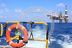 Life ring on the offshore supply boat with Jack up drilling rig
