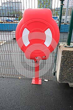 A life ring in a protective cover example of marine safety and rescue equipment