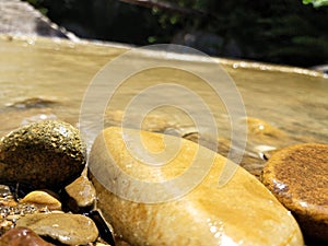 Life of rock in river from imbak canyon water fall river photo