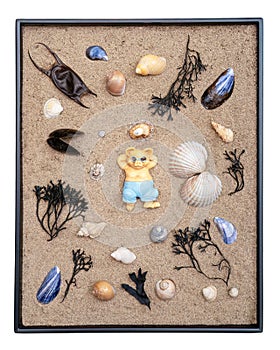 Life's a beach - flat lay image with bear, seashells, sand and seaweed.