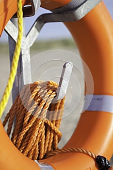 Life saver buoyancy aid with orange rope photo