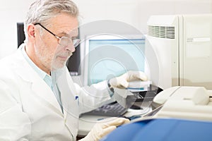 Life scientist researching in the laboratory. photo