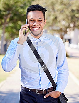 Life is for service. a young businessman using his phone outside in the city.