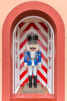 Life-size traditional Nutcracker in a door frame