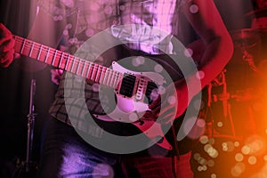 Life style image of close up young male guitarist hand, playing