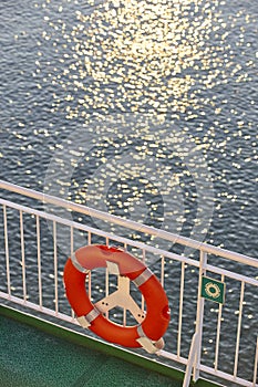 Life vest on cruise vessel. Sunset at the ocean