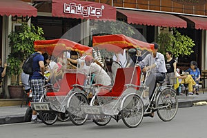 Hanoi, Vietnam, : Life in vietnam- Cyclo beside Sword lake in hanoi, vietnam. Cyclo is the tourist`s farvourite vehicle