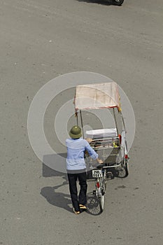 Hanoi, Vietnam, : Life in vietnam- Cyclo beside Sword lake in hanoi, vietnam. Cyclo is the tourist`s farvourite vehicle