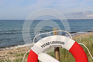 Lifebelt in front of the Baltic Sea.