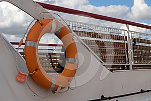 Lifebelt with lifeline on a white background on a ship
