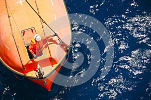 A lifeboat or life raft carried for emergency evacuation in the event of a disaster aboard a ship.