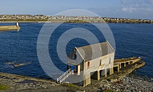 Old Lifeboat station and Lighthouse at Wick Harbour, Caithness,Scotland.UK. photo