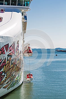 Lifeboats Lowered on Colorful Cruise Ship