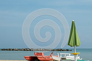 Lifeboats and an umbrella on the San Benedetto del Tronto Beach, Adriatic Sea, Ascoli Piceno, Italy