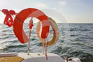 Lifebuoy aboard a yacht. Concept of water tourism. Sailing a yacht
