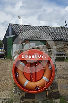 Lifebuoy against boatyard background