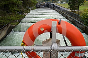 A lifebuoy attached to a bridge above a fishway at the Bonneville Dam on Bradford Island, Oregon, USA