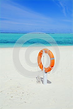 Lifebuoy and beach