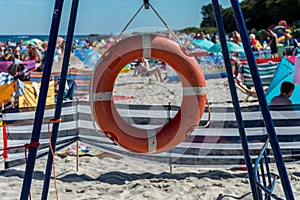 Lifebuoy on a crowded beach