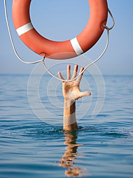 Lifebuoy for drowning man in sea or ocean water.