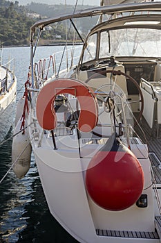 The lifebuoy in the form of a horseshoe and mooring fender close-up