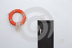 Lifebuoy, hanging on a white wall