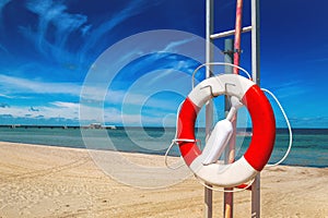 Lifebuoy, Life Preserver on Sandy Beach