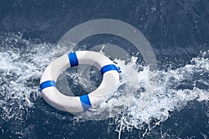 Lifebuoy, lifebelt, lifesaver in sea storm as help in danger