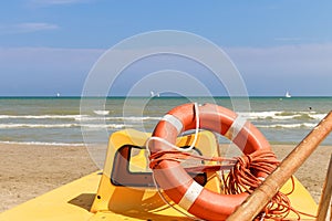 Lifebuoy on a lifeboat by the sea, Italy, Riccione