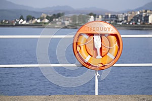 Lifebuoy orange water safety ring at Helensburgh beach