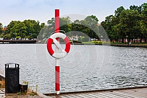 Lifebuoy by pond in the city