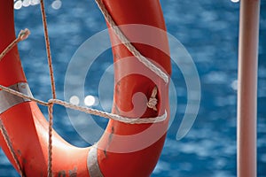 Lifebuoy on the railing of ship and Mediterranean sea