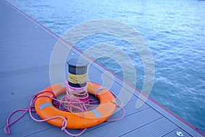 Lifebuoy ring on berth near the bollard with sea view outdoors