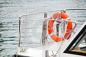 Lifebuoy and rope on the boat.