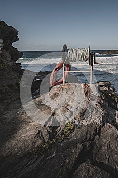 Lifebuoy with a rope for rescuing swimmers at the beach