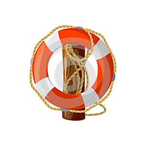 Lifebuoy with ropes on a wooden post.