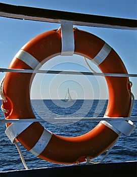 Lifebuoy and sailing boat