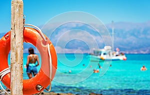 A lifebuoy, symbol of assistance, security, rescue, SOS on Golden Beach in Chrysi island, Crete, Greece