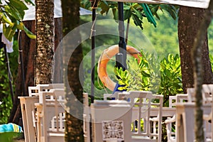 Lifebuoy on tropical beach