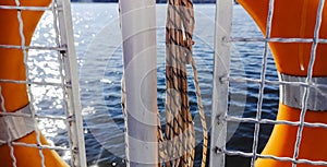 Lifebuoy. View of the water from a pleasure boat. The shine of the sun on the waves creates an atmosphere of safety and joy