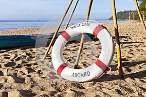 Lifebuoys for tourists are prepared on the beach in front of the resort