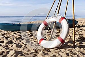 Lifebuoys for tourists are prepared on the beach in front of the resort