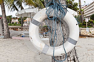 Lifebuoys for tourists are prepared on the beach in front of the resort