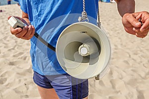 Lifeguard on the beach with a loudspeaker
