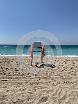 Lifeguard chair on a deserted beach on a sunny spring morning